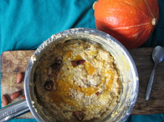 Pumpkin spice breakfast millet porridge with roasted almonds and dates